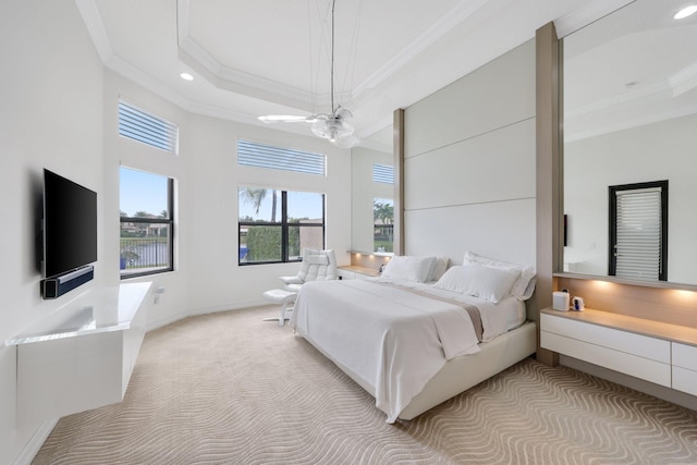 bedroom featuring ornamental molding, light carpet, a chandelier, a tray ceiling, and recessed lighting