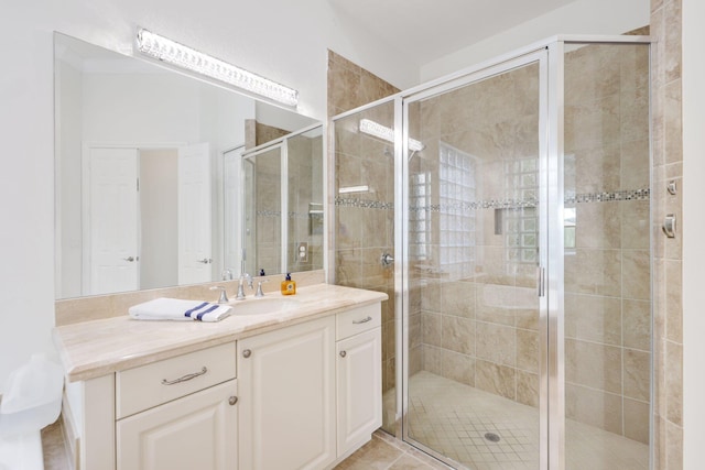 full bath featuring a stall shower and vanity