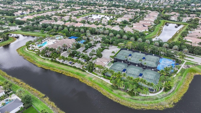 aerial overview of property's location featuring a nearby body of water and nearby suburban area