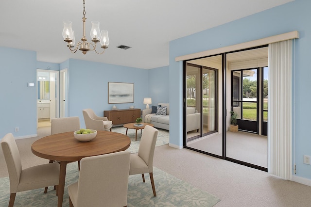 6117 Woodlake Blvd, Greenacres, FL 33463 - carpeted dining space with a chandelier and baseboards