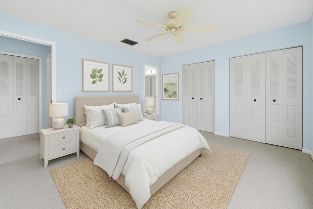 6117 Woodlake Blvd, Greenacres, FL 33463 - bedroom featuring light carpet, multiple closets, ceiling fan, and baseboards