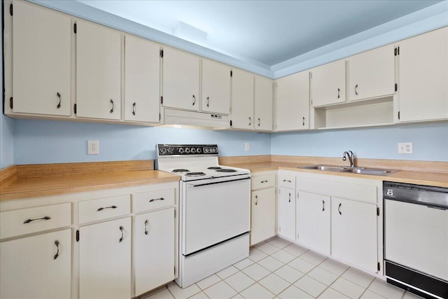 6117 Woodlake Blvd, Greenacres, FL 33463 - kitchen with white appliances, under cabinet range hood, a sink, light countertops, and light tile patterned floors