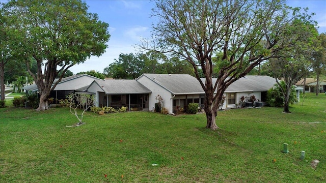 6117 Woodlake Blvd, Greenacres, FL 33463 - ranch-style house featuring a sunroom and a front lawn