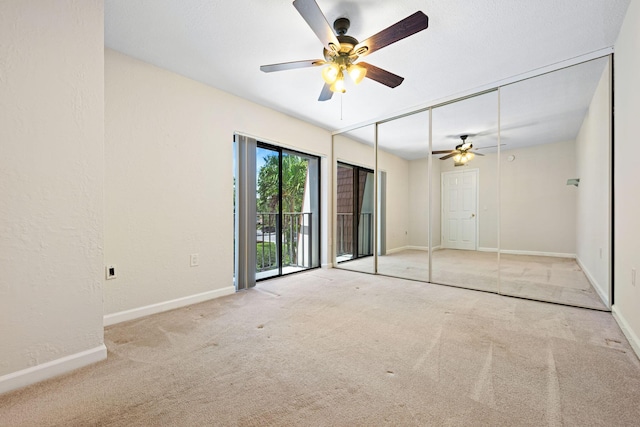 unfurnished bedroom featuring ceiling fan, access to outside, baseboards, and carpet floors