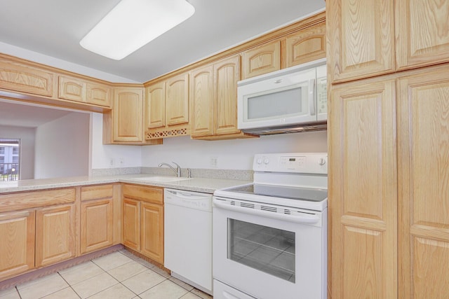 1852 SW Palm City Rd Unit 202, Stuart, FL 34994 - kitchen with white appliances, light brown cabinetry, light countertops, and light tile patterned floors