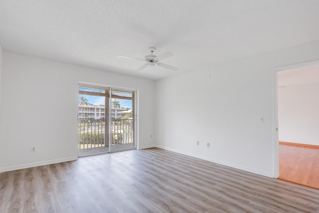 1852 SW Palm City Rd Unit 202, Stuart, FL 34994 - unfurnished room featuring wood finished floors and ceiling fan