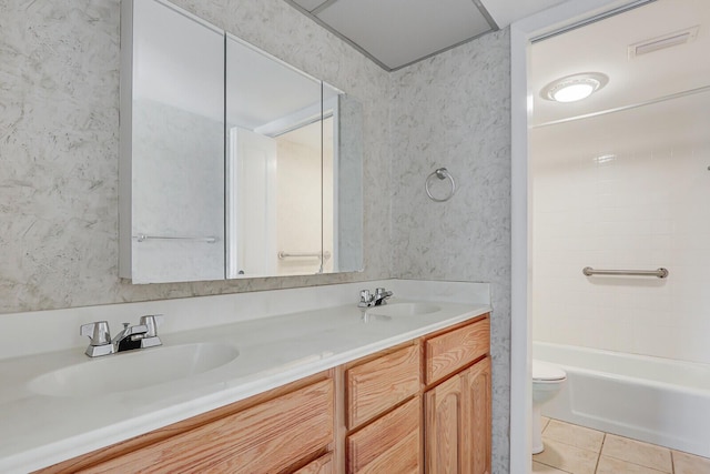 1852 SW Palm City Rd Unit 202, Stuart, FL 34994 - full bathroom with double vanity, tile patterned floors, and tub / shower combination