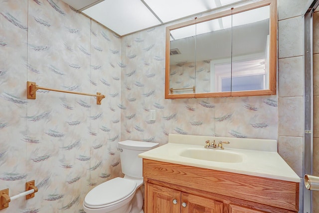 1852 SW Palm City Rd Unit 202, Stuart, FL 34994 - bathroom featuring vanity, curtained shower, and wallpapered walls