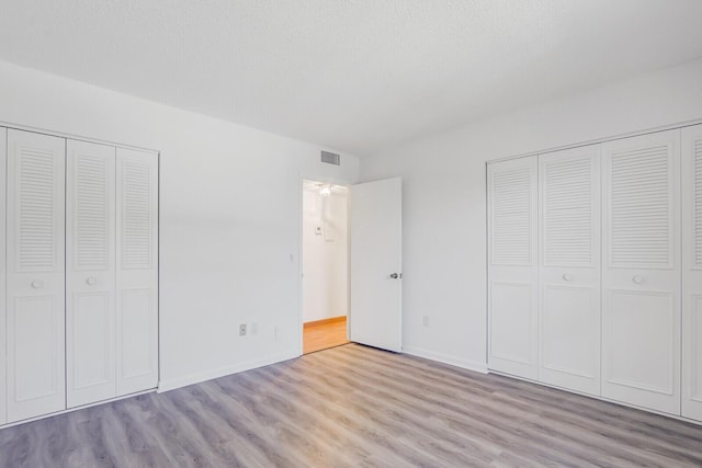 1852 SW Palm City Rd Unit 202, Stuart, FL 34994 - unfurnished bedroom with wood finished floors