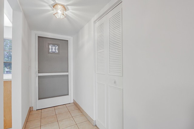1852 SW Palm City Rd Unit 202, Stuart, FL 34994 - entryway featuring light tile patterned flooring and baseboards