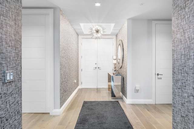 3200 S Ocean Blvd Unit 101, Highland Beach, FL 33487 - entryway featuring wood finished floors, a chandelier, and baseboards