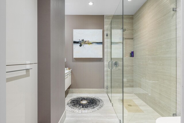 3200 S Ocean Blvd Unit 101, Highland Beach, FL 33487 - bathroom with a shower stall, vanity, and recessed lighting