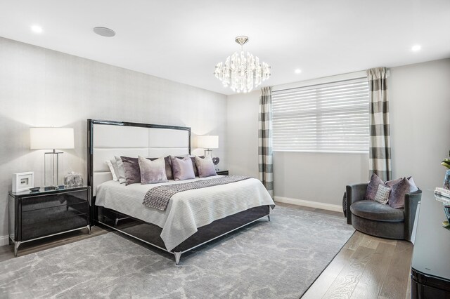 3200 S Ocean Blvd Unit 101, Highland Beach, FL 33487 - bedroom with wood finished floors, a chandelier, baseboards, and recessed lighting