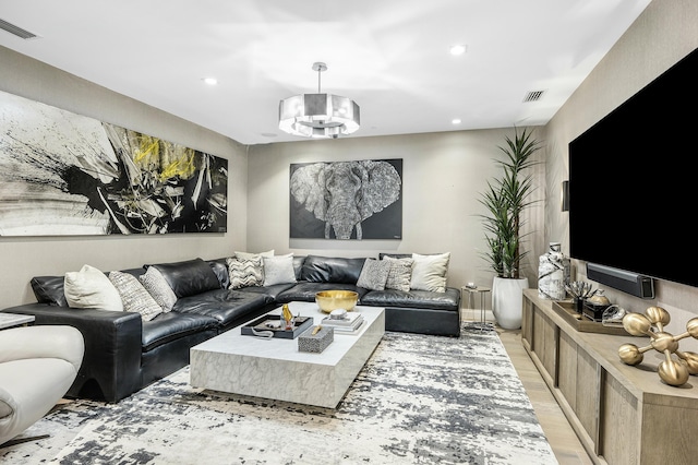3200 S Ocean Blvd Unit 101, Highland Beach, FL 33487 - living area featuring light wood finished floors, recessed lighting, and a chandelier