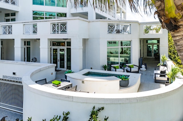 3200 S Ocean Blvd Unit 101, Highland Beach, FL 33487 - view of pool featuring french doors, an outdoor hot tub, and an outdoor hangout area