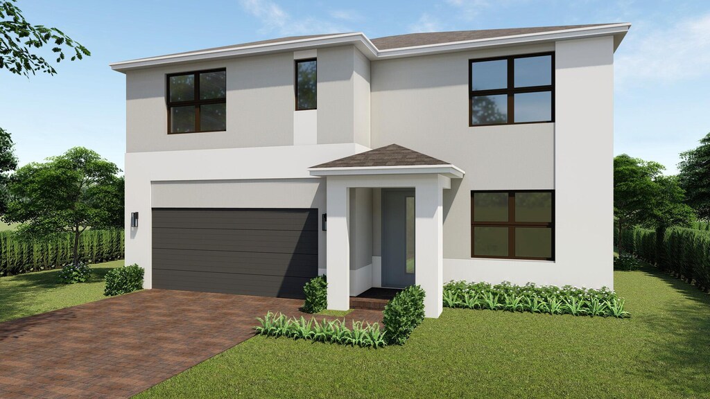 contemporary house featuring an attached garage, a front lawn, decorative driveway, and stucco siding