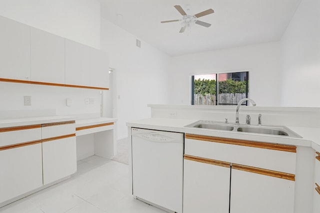 kitchen with light countertops, a sink, and white dishwasher