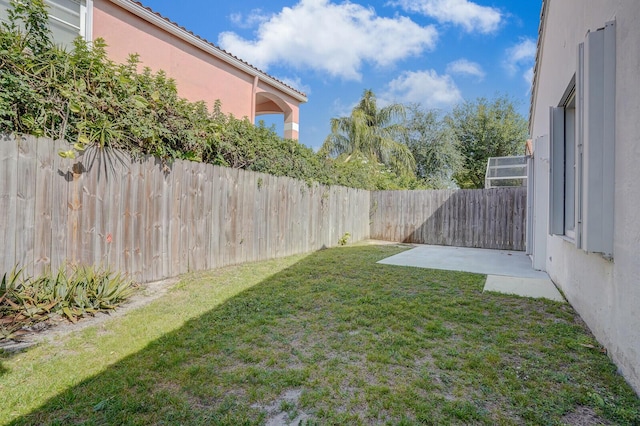view of yard with a fenced backyard