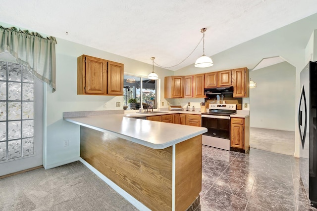 kitchen with freestanding refrigerator, light countertops, stainless steel electric range, under cabinet range hood, and a sink