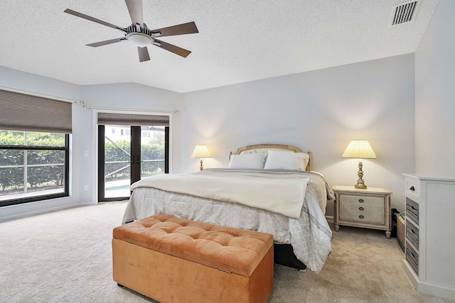 22652 Esplanada Cir W, Boca Raton, FL 33433 - bedroom with light carpet, access to exterior, a textured ceiling, lofted ceiling, and a ceiling fan
