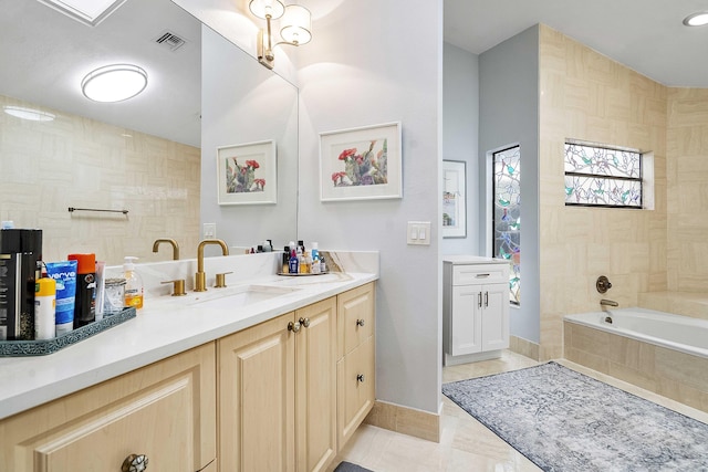 22652 Esplanada Cir W, Boca Raton, FL 33433 - full bathroom featuring vanity, a relaxing tiled tub, and tile patterned flooring