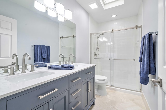 22652 Esplanada Cir W, Boca Raton, FL 33433 - full bathroom with toilet, double vanity, a shower stall, a skylight, and baseboards