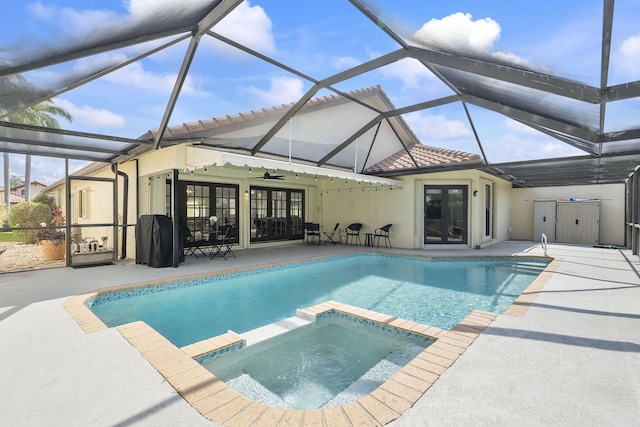 22652 Esplanada Cir W, Boca Raton, FL 33433 - view of pool featuring french doors, a patio, a pool with connected hot tub, and glass enclosure
