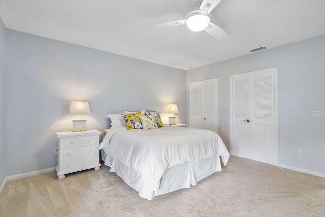 22652 Esplanada Cir W, Boca Raton, FL 33433 - carpeted bedroom featuring multiple closets, baseboards, and a ceiling fan