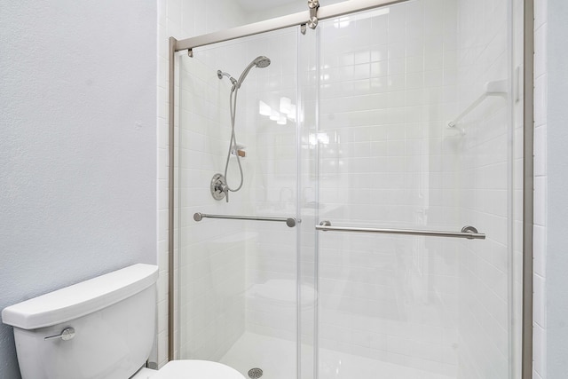 22652 Esplanada Cir W, Boca Raton, FL 33433 - bathroom featuring toilet, a stall shower, and a textured wall