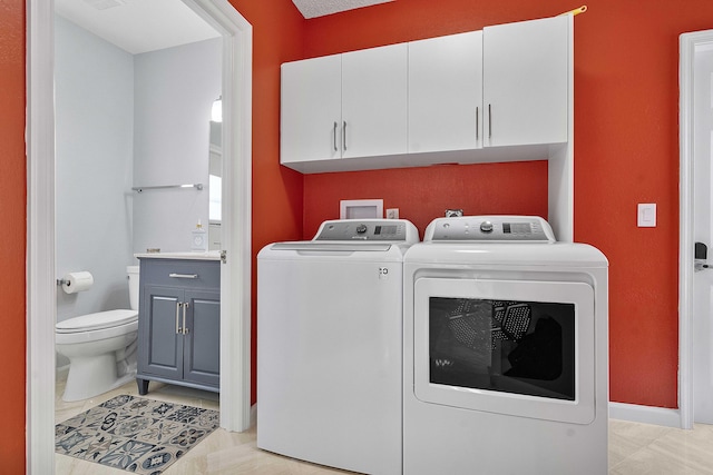 22652 Esplanada Cir W, Boca Raton, FL 33433 - washroom featuring separate washer and dryer, cabinet space, and baseboards