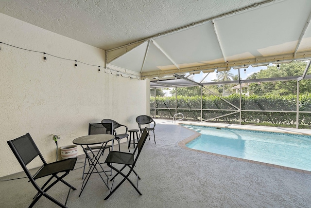 22652 Esplanada Cir W, Boca Raton, FL 33433 - outdoor pool featuring a patio area and glass enclosure