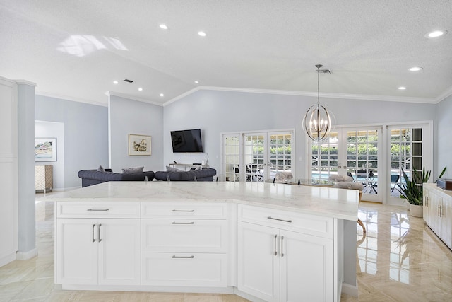 22652 Esplanada Cir W, Boca Raton, FL 33433 - kitchen with open floor plan, lofted ceiling, light stone counters, recessed lighting, and a chandelier