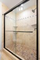 full bathroom with a shower stall