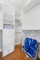 spacious closet featuring wood finished floors