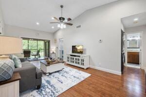 living room featuring ceiling fan, wood finished floors, lofted ceiling, baseboards, and recessed lighting