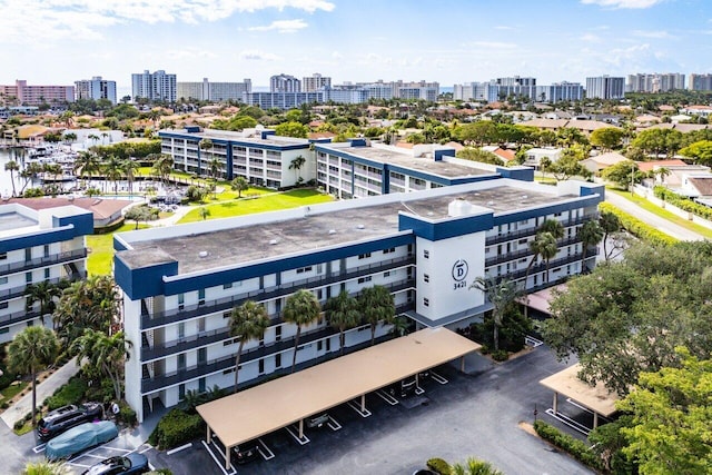 birds eye view of property featuring a city view