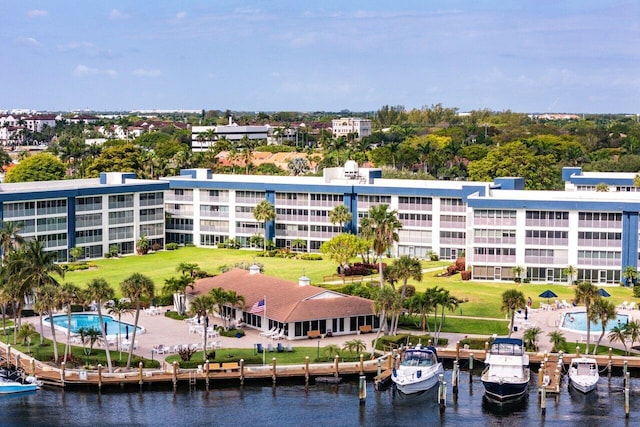 birds eye view of property with a water view