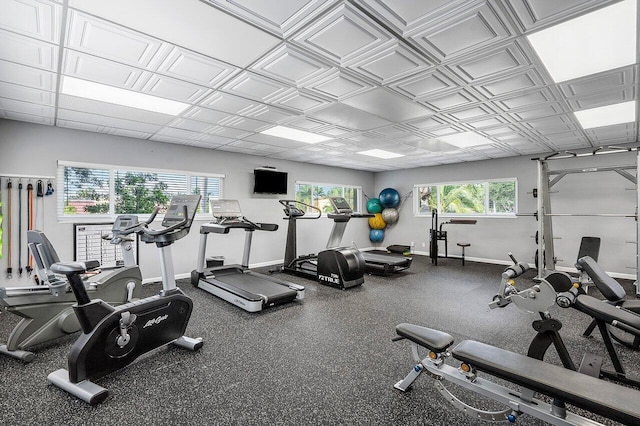 workout area featuring baseboards