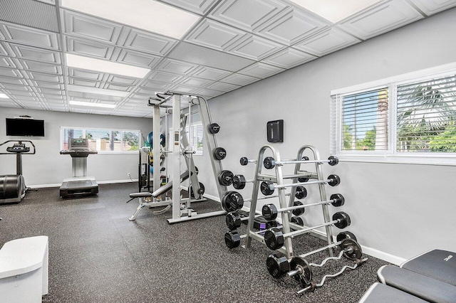 workout area featuring baseboards