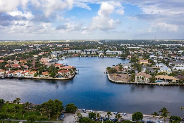 birds eye view of property featuring a water view and a residential view