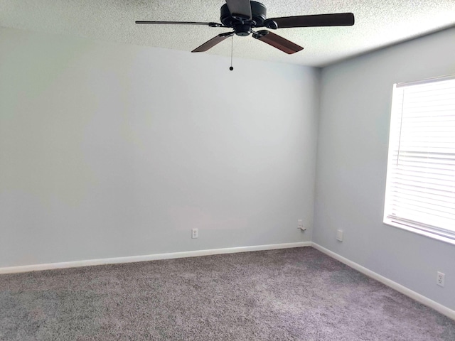 701 Sabal Ridge Cir Unit C, Palm Beach Gardens, FL 33418 - spare room featuring a ceiling fan, a textured ceiling, carpet flooring, and baseboards