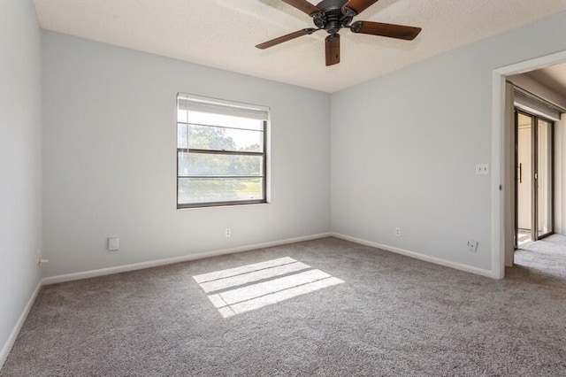 701 Sabal Ridge Cir Unit C, Palm Beach Gardens, FL 33418 - carpeted spare room with a ceiling fan and baseboards