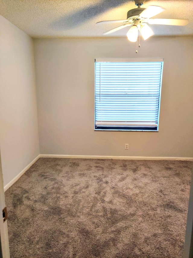 701 Sabal Ridge Cir Unit C, Palm Beach Gardens, FL 33418 - carpeted empty room featuring ceiling fan, a textured ceiling, and baseboards