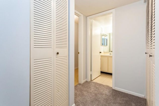 701 Sabal Ridge Cir Unit C, Palm Beach Gardens, FL 33418 - hall with light colored carpet and baseboards