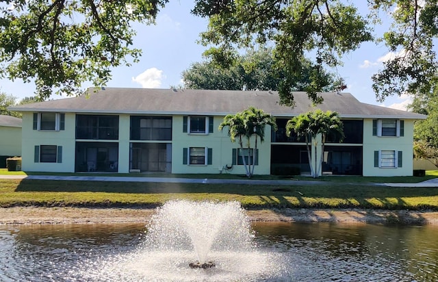 701 Sabal Ridge Cir Unit C, Palm Beach Gardens, FL 33418 - rear view of property with a water view, a lawn, and stucco siding