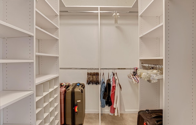 spacious closet featuring tile patterned floors