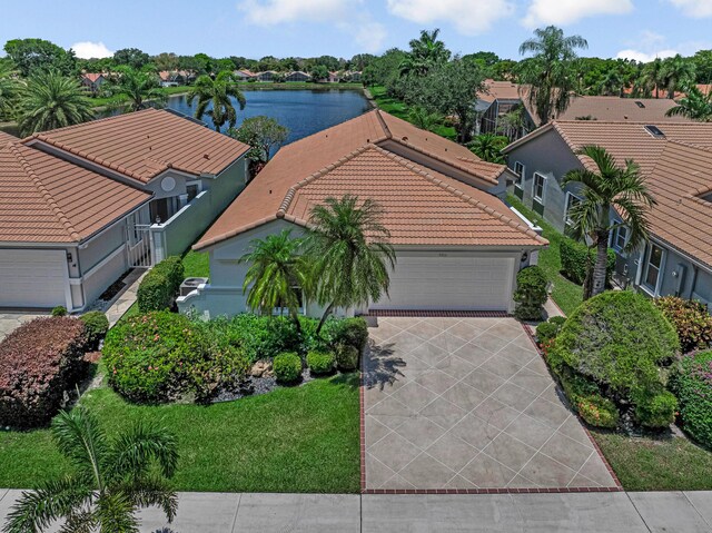 9703 Harbour Lake Cir, Boynton Beach, FL 33437 - back of property with glass enclosure, stucco siding, and a residential view