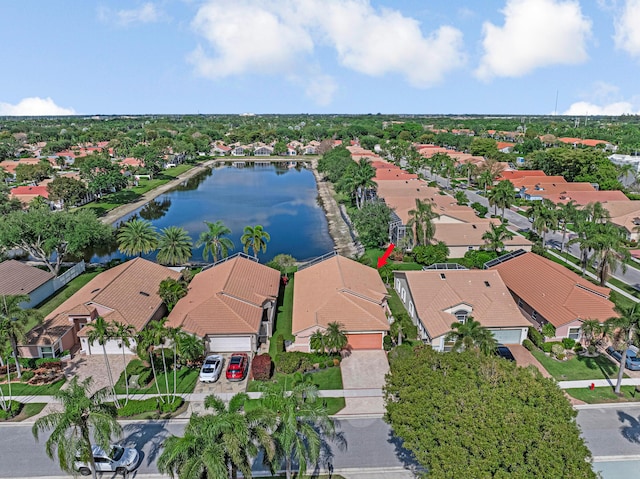 birds eye view of property with a residential view and a water view