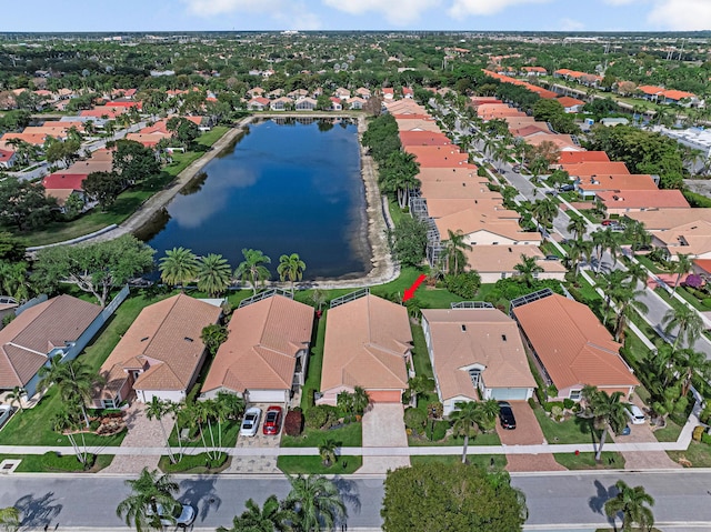 birds eye view of property featuring a water view and a residential view