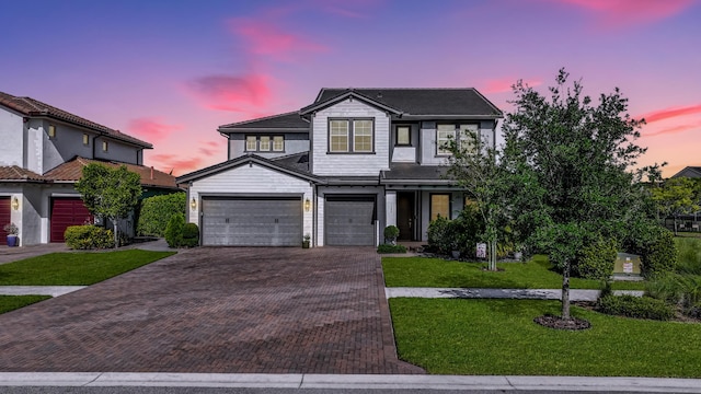 1104 Wandering Willow Way, Loxahatchee, FL 33470 - traditional home with an attached garage, decorative driveway, and a front lawn